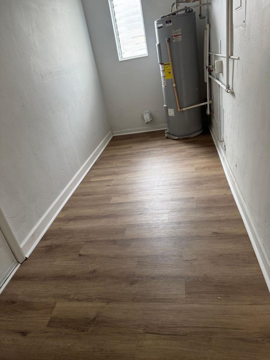 Vinyl plank in a San Jose Jacksonville utility room with water heater