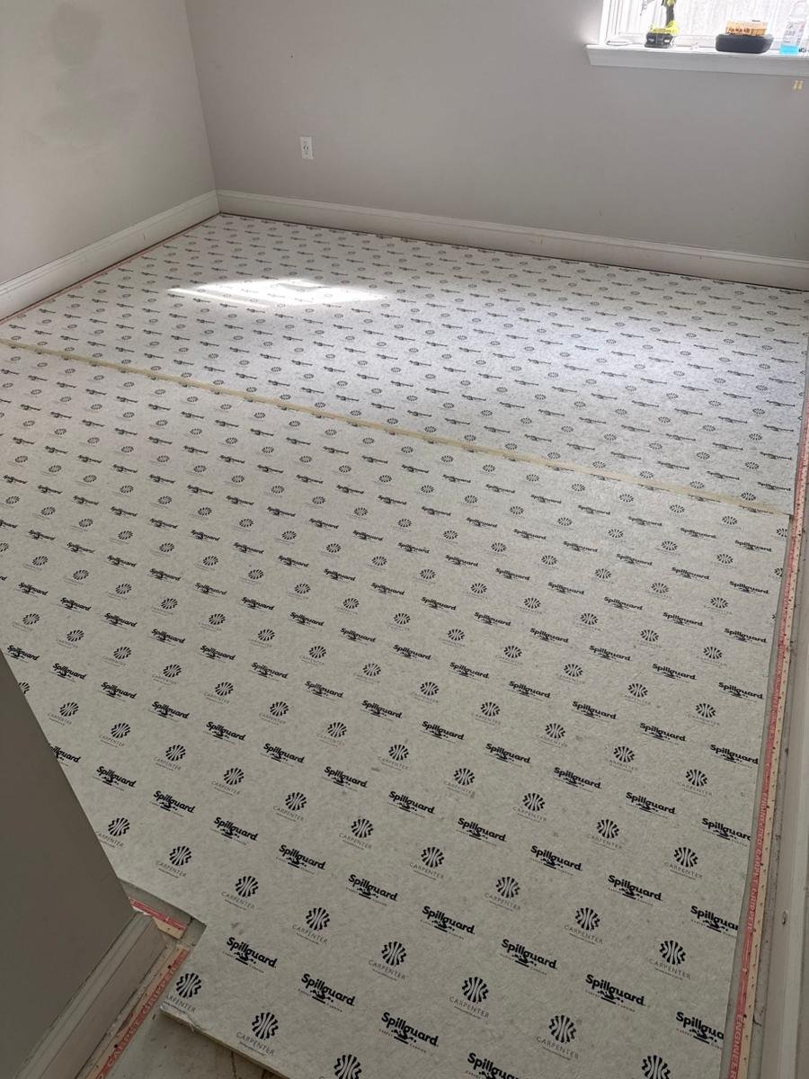 New Spillguard carpet pad and tack strip installed in a Jacksonville bedroom