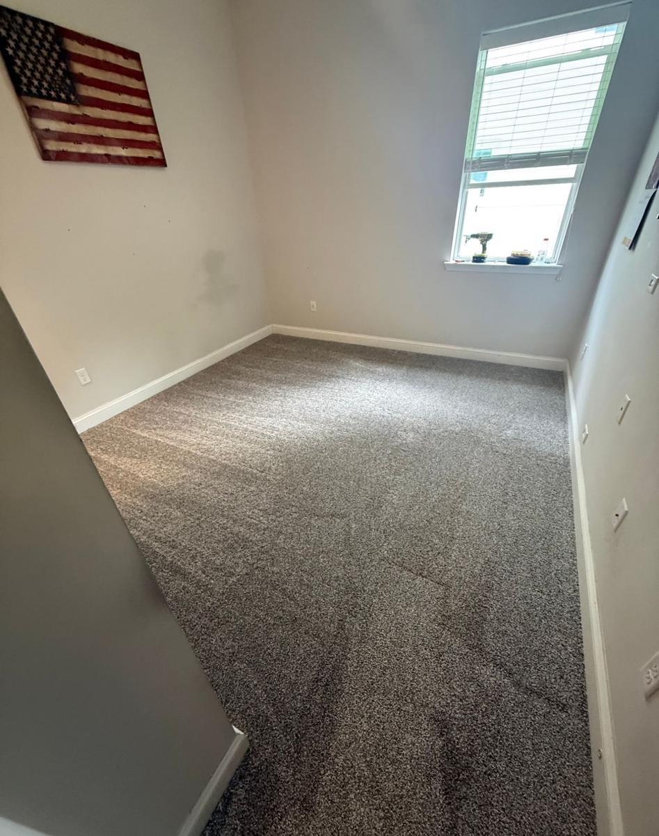 Finished new carpet installation in a Jacksonville bedroom
