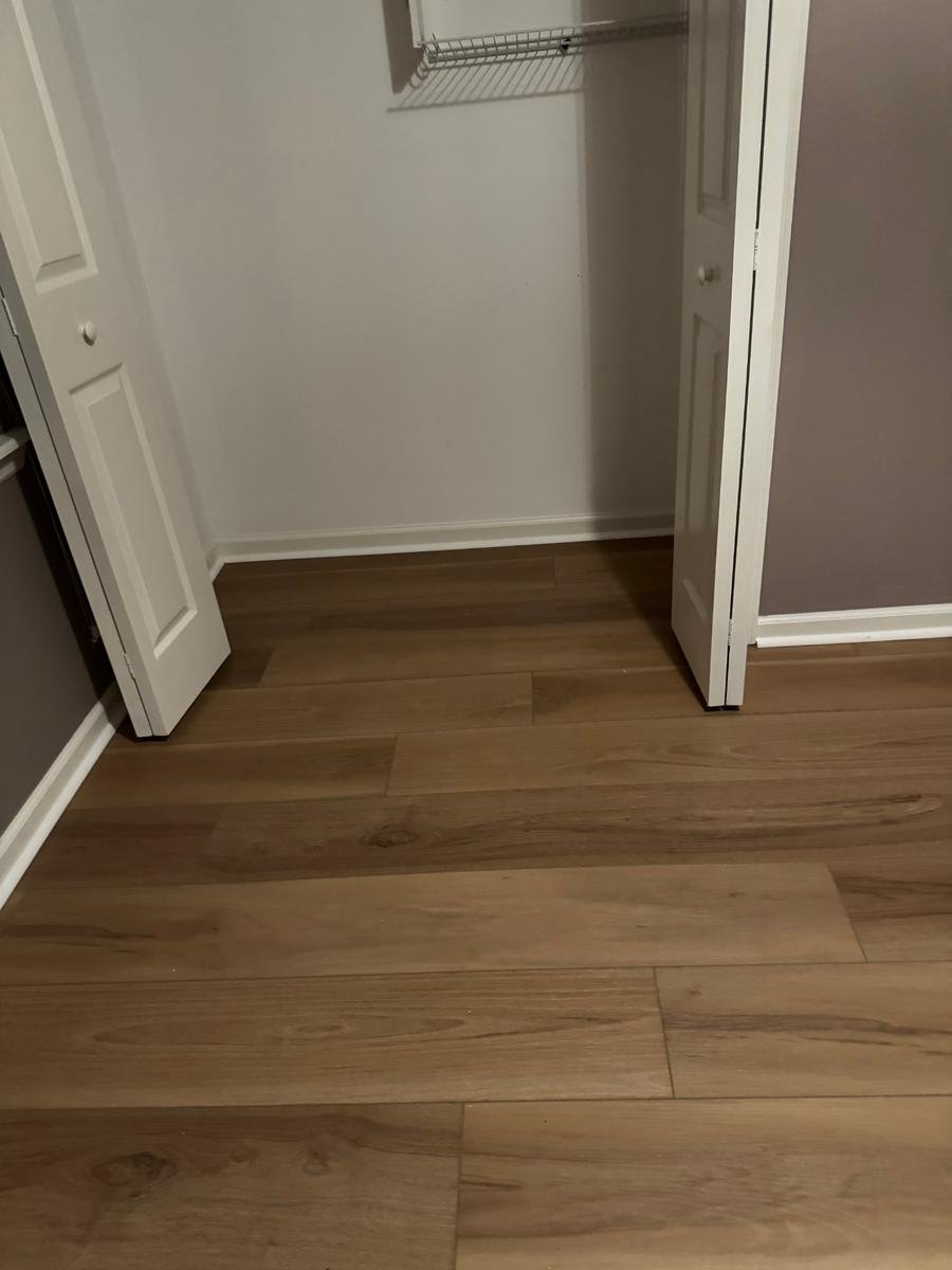 Luxury vinyl plank continued into a bedroom closet in a Northside Jacksonville home