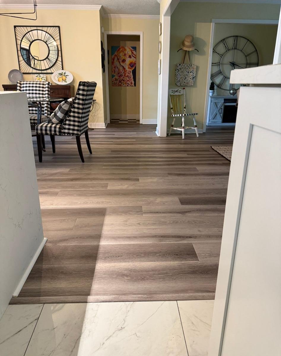 Vinyl plank running from the kitchen into the dining room in a Mandarin, Jacksonville home
